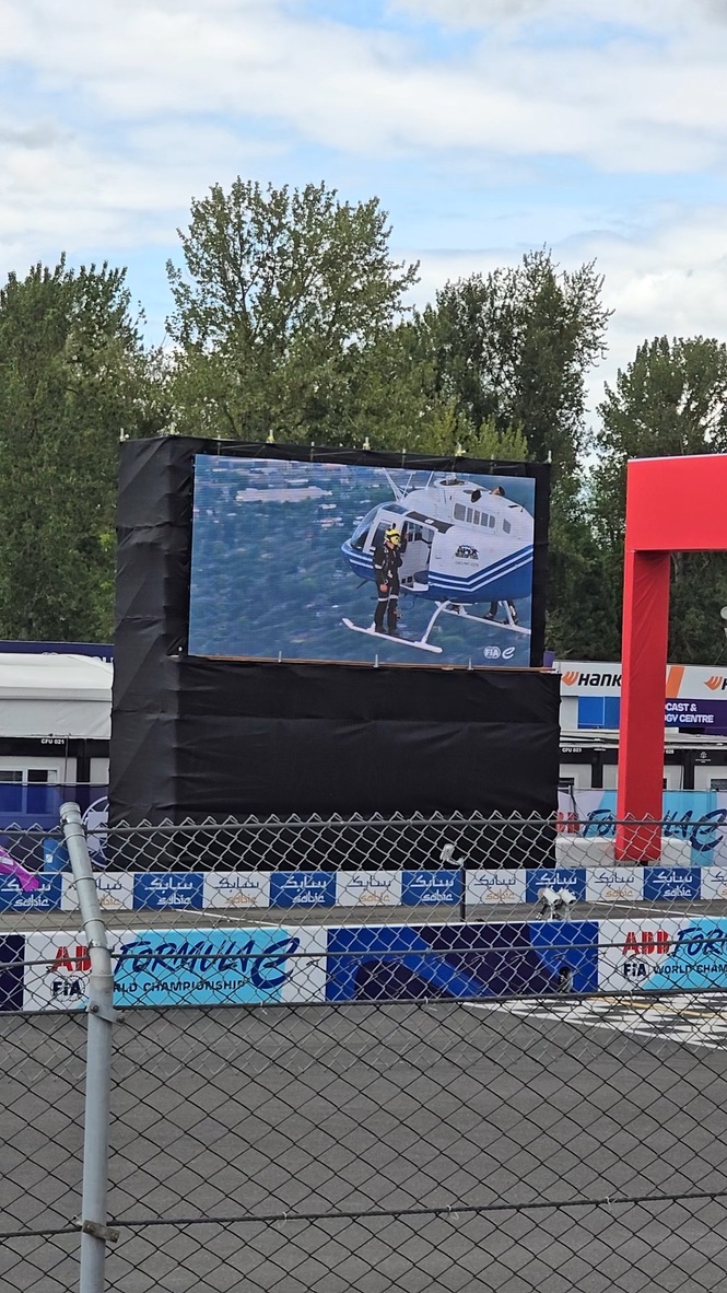 Airshow video board showing a helicopter demonstration