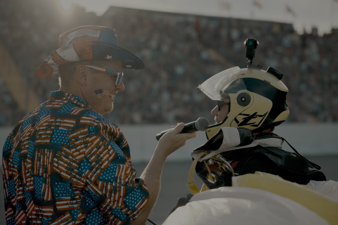Interview with helmeted skydiver at an airshow
